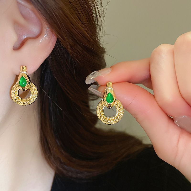 Pendientes de camelia de simulación de aguja de plata Pendientes elegantes retro francés Pendientes de todo fósforo de moda personalizada
