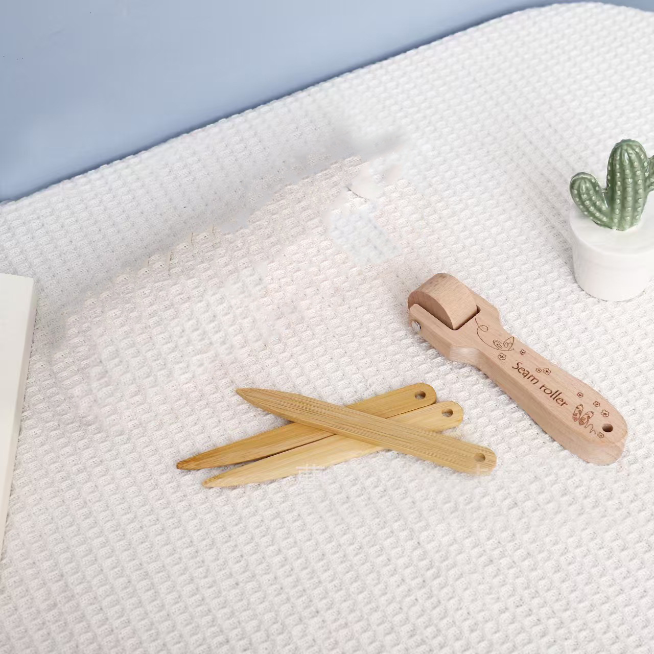 Bone pen + cloth pressing wheel