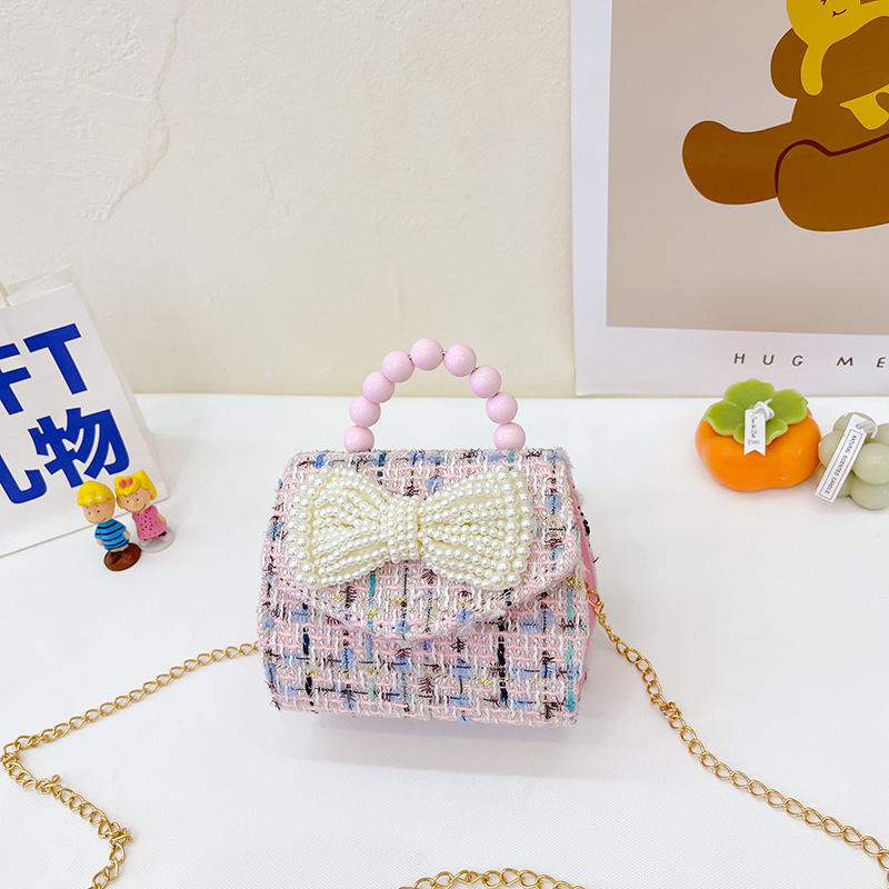 2022 nuevo arco de la celebridad en línea tejida bolso de los niños de las mujeres de estilo coreano lindo crossbody mini bolso de la perla