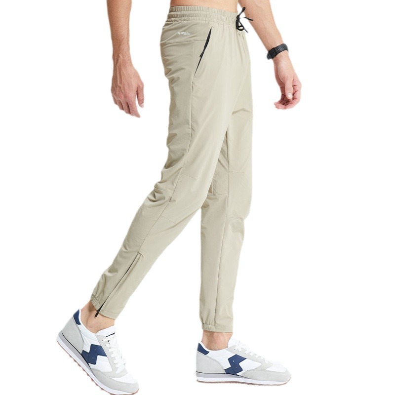 Pantalones de secado rápido impermeables para exteriores Pantalones deportivos de fitness transpirables y resistentes al desgaste de escalada de pies con cremallera elástica delgada tejida para hombres