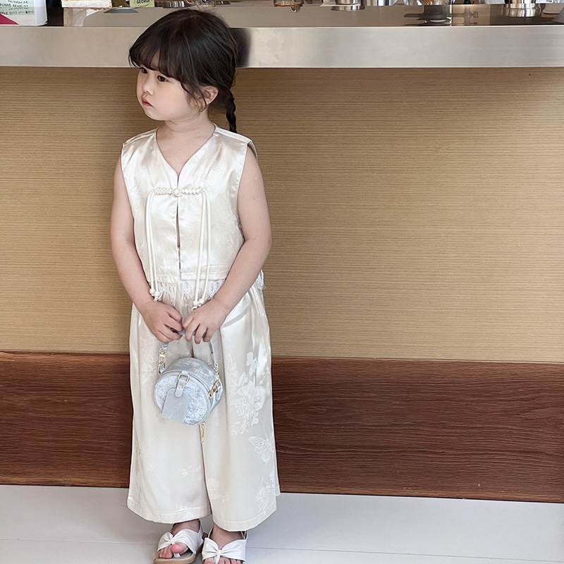 Bolsa de hombro coreana para niños y niñas de color sólido de perlas extranjeras mini bolso para bebés 2025 nueva cadena bolso para niños