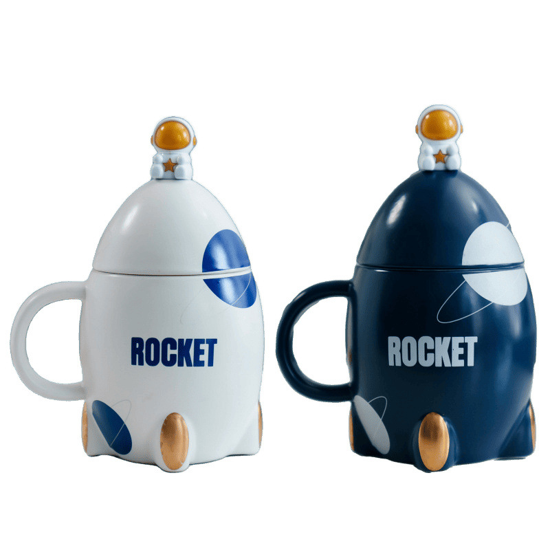 Taza de cerámica de cohete de dibujos animados Taza creativa con cuchara de tapa Taza de café de leche de dibujos animados lindo ins de alto valor