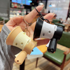 個性的なミニ録音のスピーカーのキーホルダーは、大声のスピーカーのカバンを持って子供のおもちゃのバッチを持っているのを責めます。
