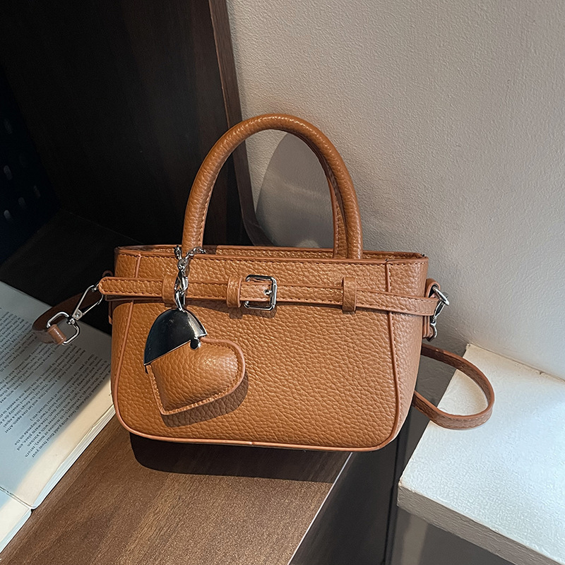 Bolso Tote de diseño de nicho 2025 verano nuevo estilo bolso de hombro con patrón de lichi bolso de mensajero de amor de moda mujer