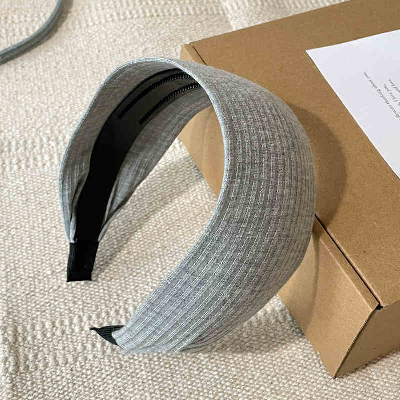 Otoño y invierno de alta sensibilidad para el cabello de mujeres cráneo alto borde amplio agujero de punto de banda de cabeza muestra cara pequeña gris ensanchada banda de cabello