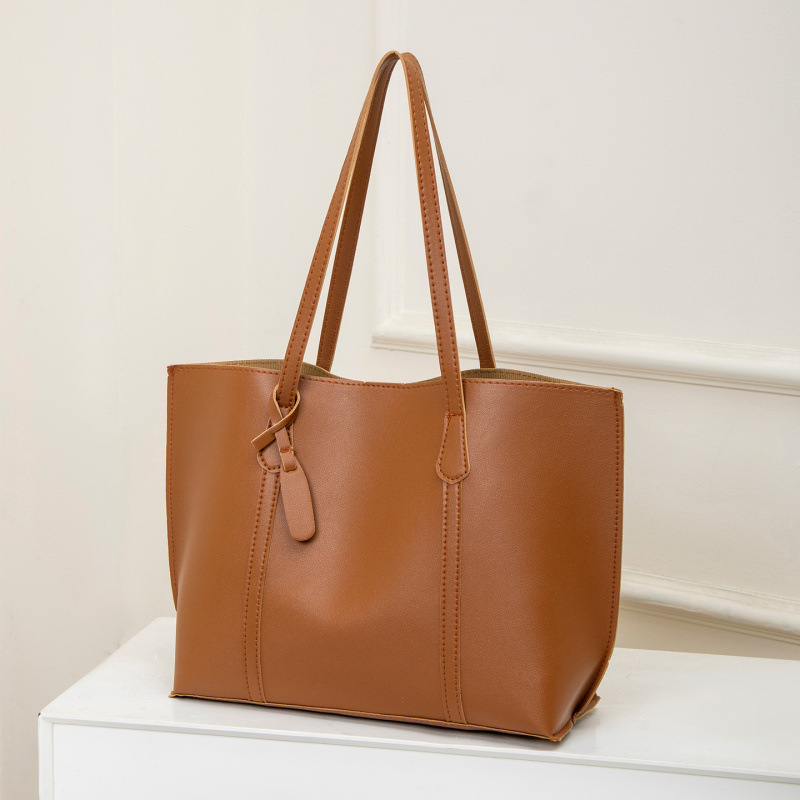 2025 otoño y invierno nuevo nicho Zhong tote bolso de cuero suave de gran capacidad para mujeres bolso de viaje de alta calidad bolso de hombro ocio