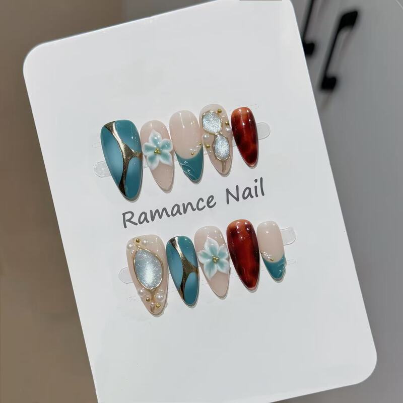 Handmade press-on nails with blue and green gradient, three-dimensional flowers, gold foil, and pearls, creating an elegant, trendy, and flattering manicure Handmade press-on nails with blue and green gradient, three-dimensional flowers, gold foil, and pearls, creating an elegant, trendy, and flattering manicure