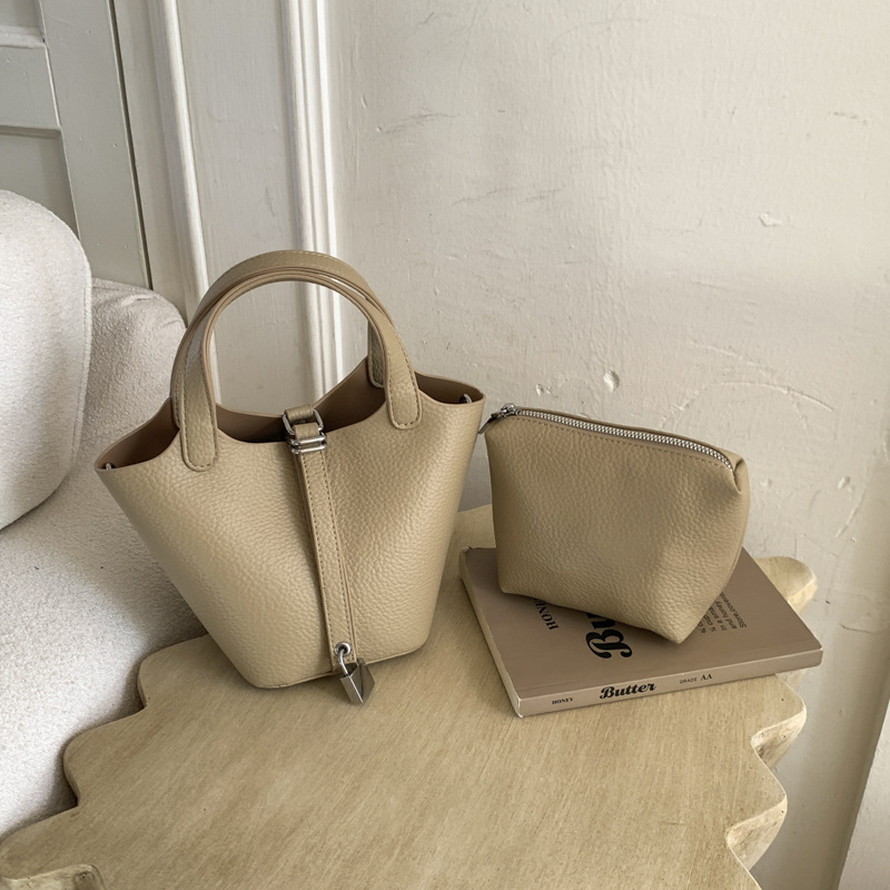 Cestas clásicas de platos bolsas de cubo de mano nicho coreano de litchi de textura alta moda versátil bolso de mochila