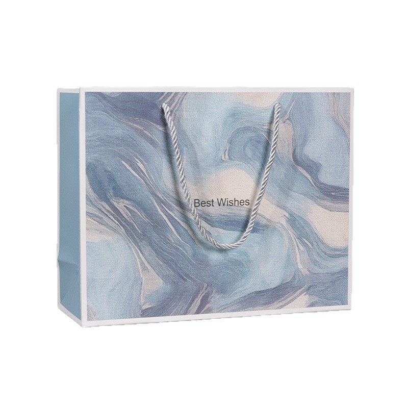 Nueva bolsa de mano espesa bolsa de regalo cartón blanco impresión de color cosméticos tienda de ropa bolsa de regalo fábrica al por mayor
