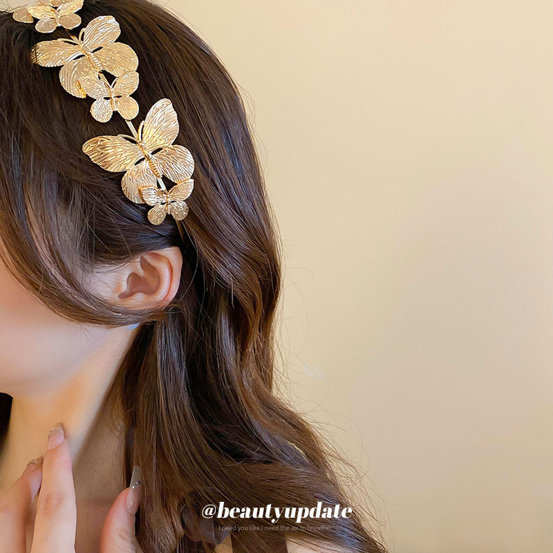Diadema de metal de mariposa, diadema de presión superior de alta cabeza simple de moda, sentido de alta calidad, personalidad, todo fósforo, nuevos accesorios para el cabello al por mayor