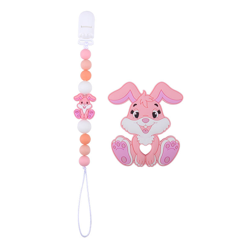 Amazon nuevo bebé suministros de dibujos animados conejo de silicona juguete mordedor pezón anti-gota cadena molar traje