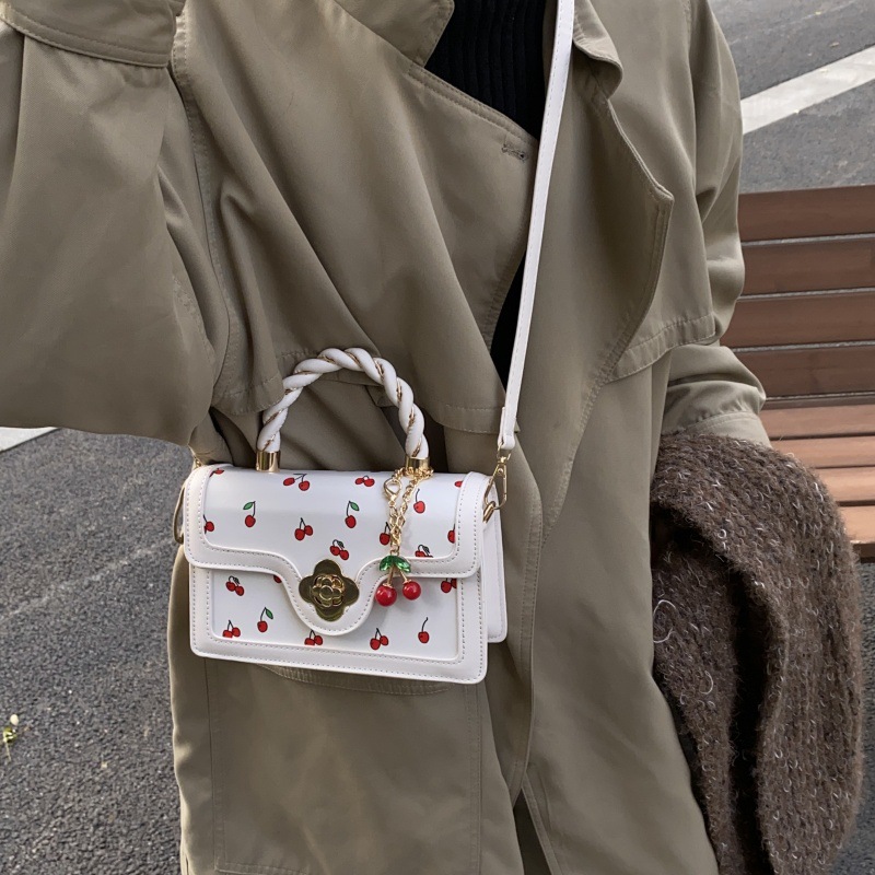 Bolso de moda coreano 2024 otoño e invierno nuevo bolso femenino lindo bolso de hombro de cereza estilo occidental color contraste bolso de mensajero marea
