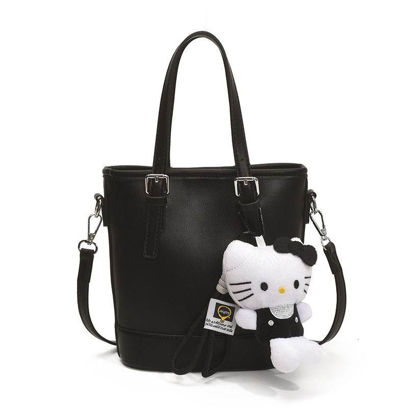 2025 nuevo bolso de cubo portátil de diseño de nicho bolso de hombro de viajero de todo fósforo de moda femenina bolso de mensajero de estilo occidental de color sólido