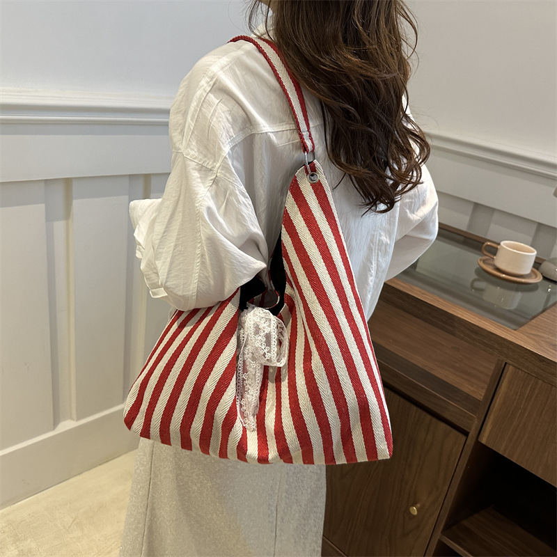Bolsa de lona a rayas para mujeres verano 2024 nueva moda nicho coreano bolso especial bolso de tela de gran capacidad para estudiantes