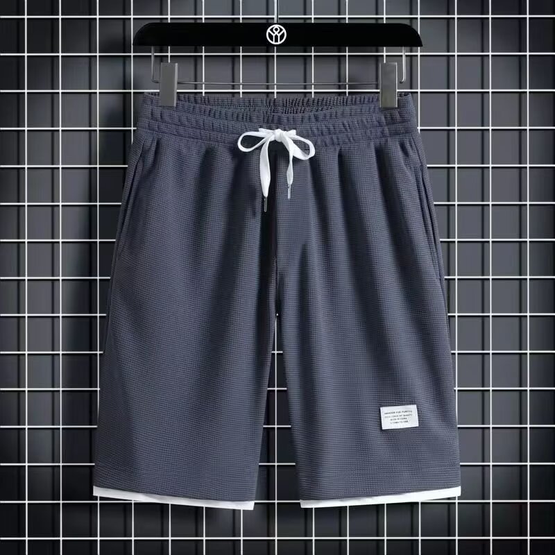 Camisa menos ropa Waffle pantalones de cinco puntos para hombres verano nuevo estilo estilo Hong Kong pantalones cortos de dos piezas falsos de color recto suelto