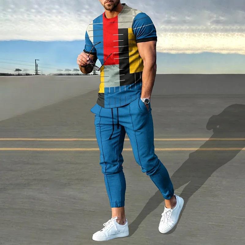 男性のスーツの夏の青年の半袖のtシャツのストライプは色のゆったりした弾力の薄い運動のズボンの2つのセットをつづり合わせます。|undefined
