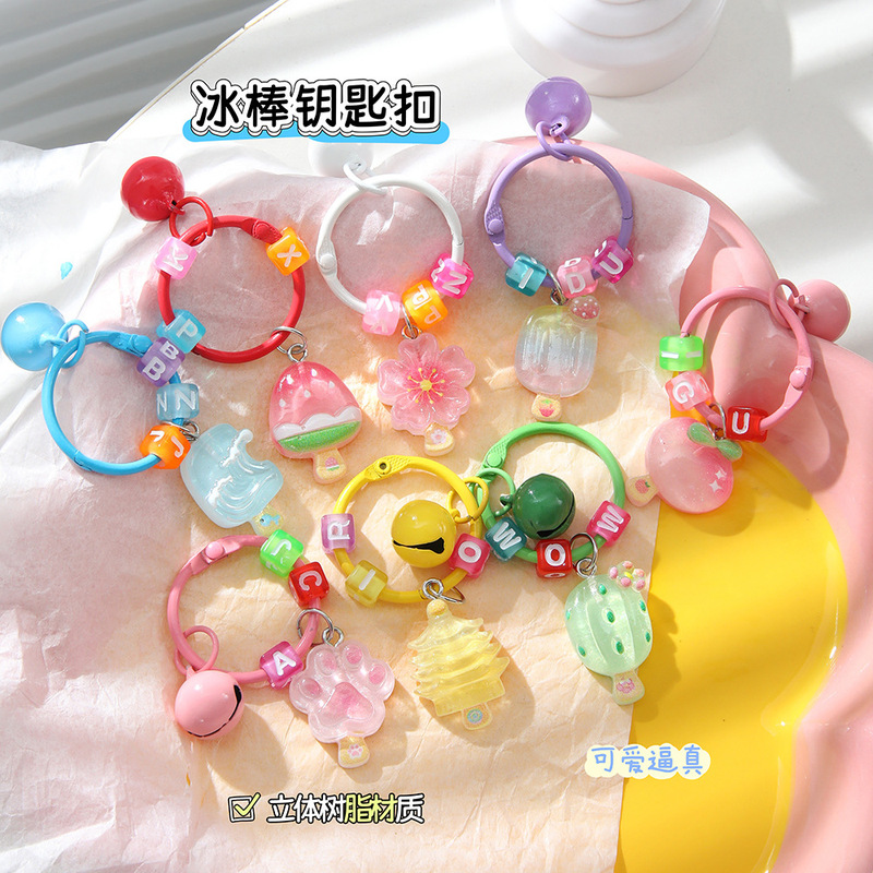 Macaron-Style Painted Bell Keychain with Cartoon Letter Ring Pendant, High Aesthetic Creative Popsicle Accessory Macaron-Style Painted Bell Keychain with Cartoon Letter Ring Pendant, High Aesthetic Creative Popsicle Accessory