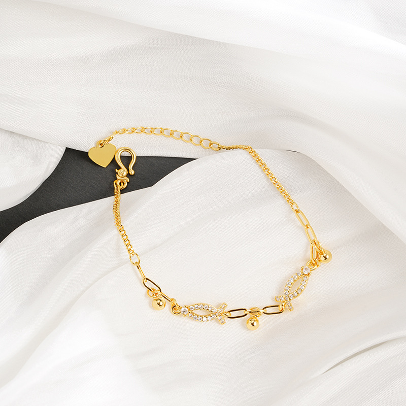 Nuevo producto pulsera de oro de lujo ligera línea de pulsera de oro de lujo pequeño pez bordilla esfera pulsera de moda femenina joyas de mano versátiles