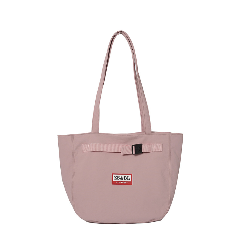 Bolso de letras coreanas 2025 verano nuevo bolso femenino bolso de lona para estudiantes bolso de hombro casual de gran capacidad