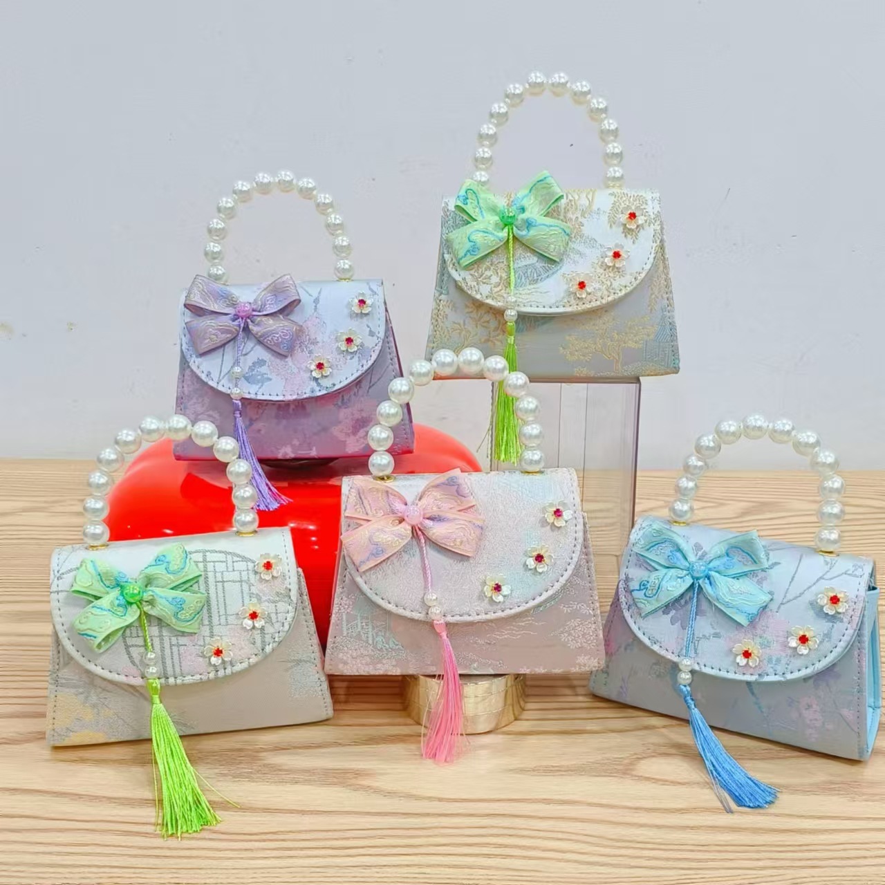 Bolsas de niños arco de estilo chino bordilla accesorios de niñas bolsas de mano princesa de perlas bolsa de cambio