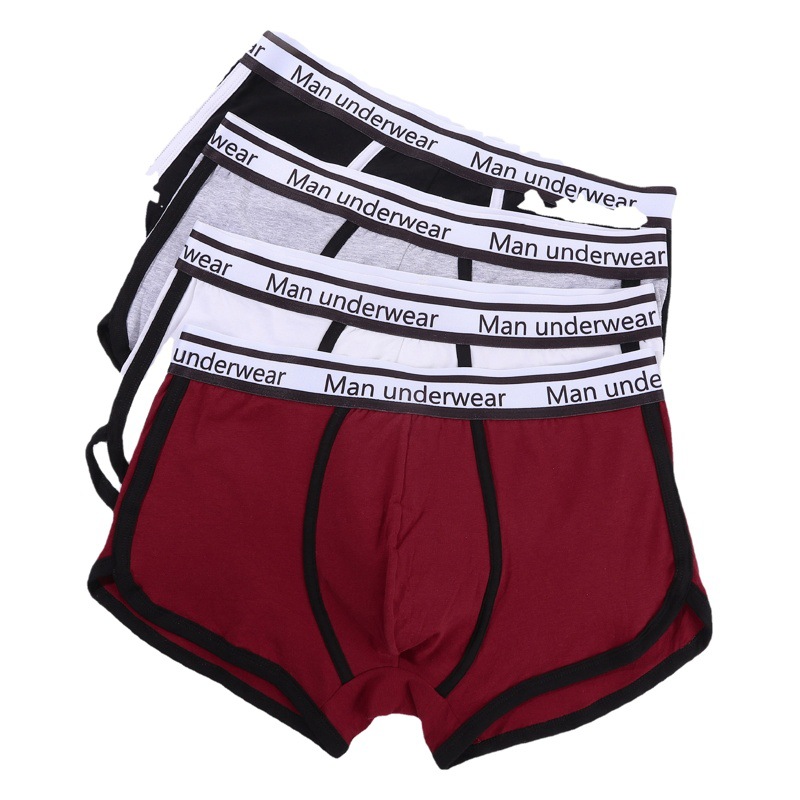 Tamaño europeo simple sexy color sólido letras cómodo algodón transpirable ropa interior boxeadores de los hombres en stock al por mayor