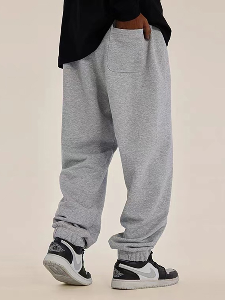2026 pantalones de protección de tubo recto relajados en Europa y los Estados Unidos pantalones deportivos para hombres, pantalones de piernas anchas estadounidenses en otoño e invierno, tendencia de ocio.
