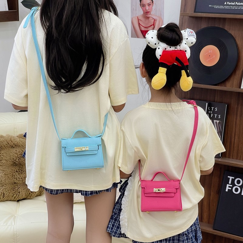 Bolso de hombro para niños y niñas de estilo coreano mini bolso de mensajero para padres e hijos de color sólido simple nuevo monedero con cerradura para niños
