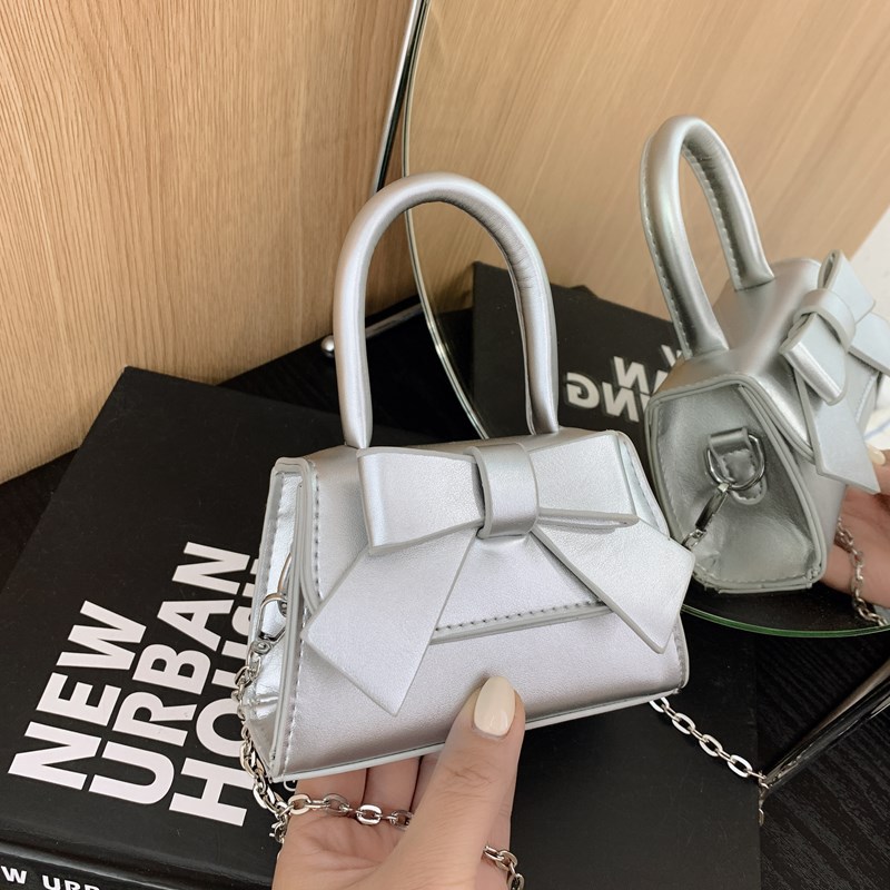 Bolso de mujer 2025 tendencia de primavera nuevo arco de moda para niños bolso de hombro de estilo extranjero bolso de mano