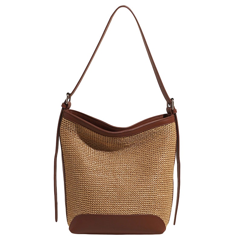 Bolso tejido de paja de mensajero de todo fósforo 2025 simple verano vacaciones en la playa cubo tejido nuevo bolso de playa de moda femenina