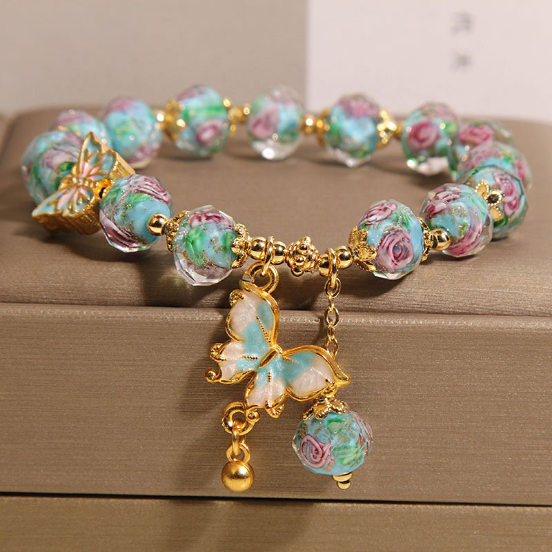 Nueva pulsera de vidrio azul de jardín de rosas de estilo chino para mujer, pulsera colgante de mariposa de lujo ligero de nicho, joyería de alta calidad