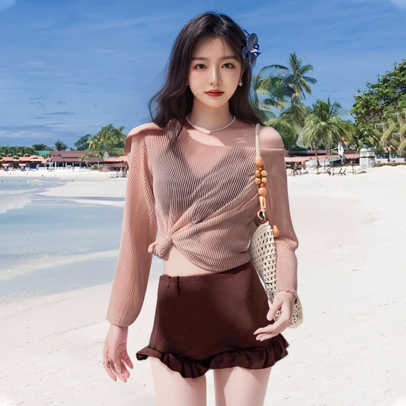 Traje de baño femenino venta caliente versión coreana de moda dividida de tres piezas que cubre la carne, delgado y conservador traje de baño de vacaciones de aguas termales para estudiantes de manga larga