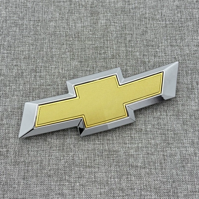 to Chevrolet Cruze Models: Car logo - front-mark-silver-gold