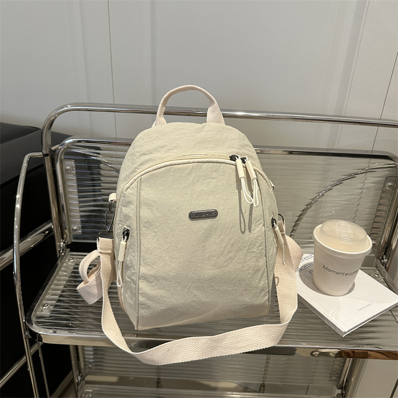 Mochila de verano nueva mochila de viaje de viaje de gran capacidad bolso de hombro de moda todo-fósforo femenino ligero