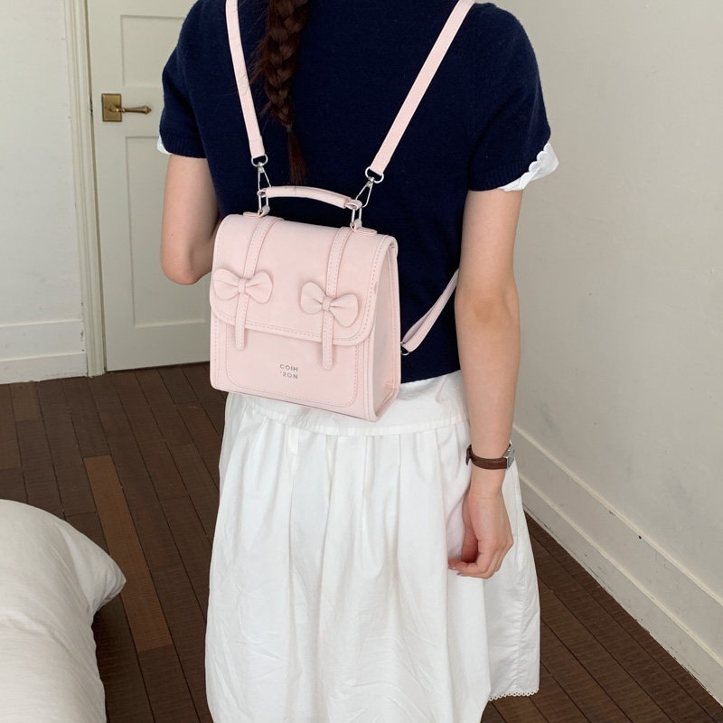 Mochila de temperamento de viaje femenino 2026 de alto valor de cara simple coreana mochila de viaje nuevo arco bolso pequeño
