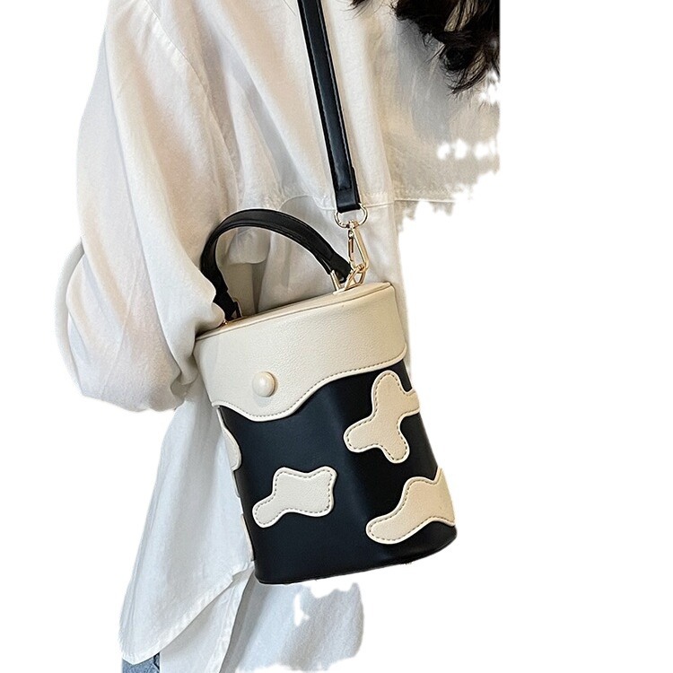 Κορίτσι χαριτωμένο μικρό 2024 νέα άνοιξη/καλοκαίρι χειρός κυλινδρική ευέλικτη τσάντα χιαστί με έναν ώμο_voghion.com