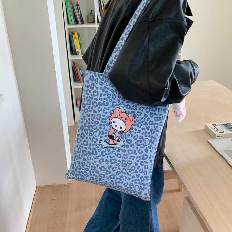 Bolsa de moda de balde, bolso de lona universal, mujer, otoño y invierno 2025, nuevo modelo de bolso de hombro con patrón de leopardo, bolso de brazo de viaje