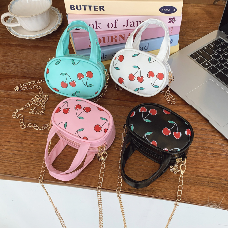 2026 primavera nuevo bolso para niños fresco lindo pequeño bolso de cereza bebé mini bolso de cadena para niños y niñas