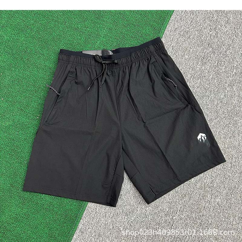 Fabricantes al por mayor de pantalones cortos deportivos para hombres de velocidad de hielo seco maratón de verano delgado entrenamiento de acondicionamiento físico pantalones de moda