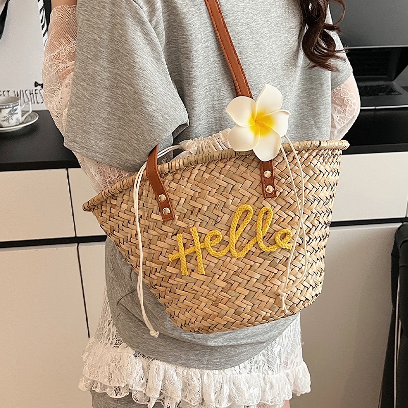 Bolso de verano para mujer, bolso versátil 2025, bolso de hombro de paja tejido sencillo para vacaciones, nuevo estilo.