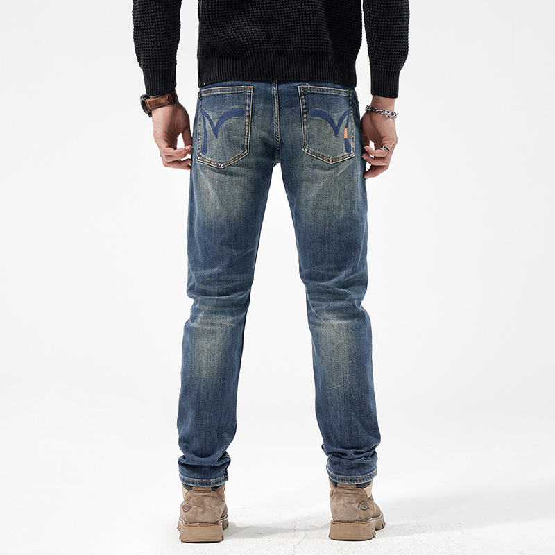 Comercio exterior moda moda juvenil nostálgica jeans lujoso ligero hombre cómodo delgado elástico pie pequeño jeans al por mayor