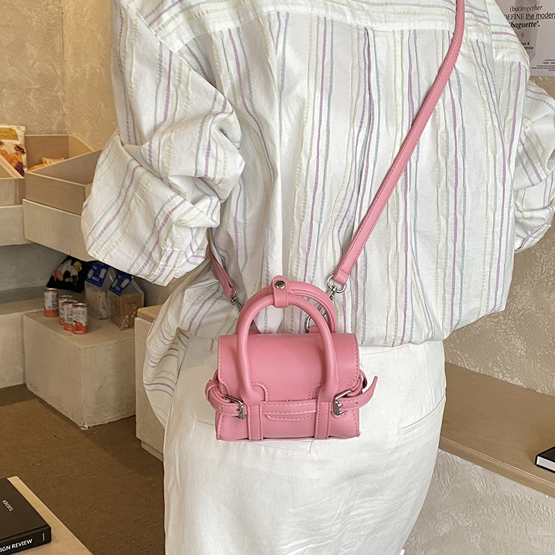 Bolsos de mano de chicas extranjeras de empalme de correa simple color sólido mini mochila 2026 nuevo estilo coreano bolsos para niños