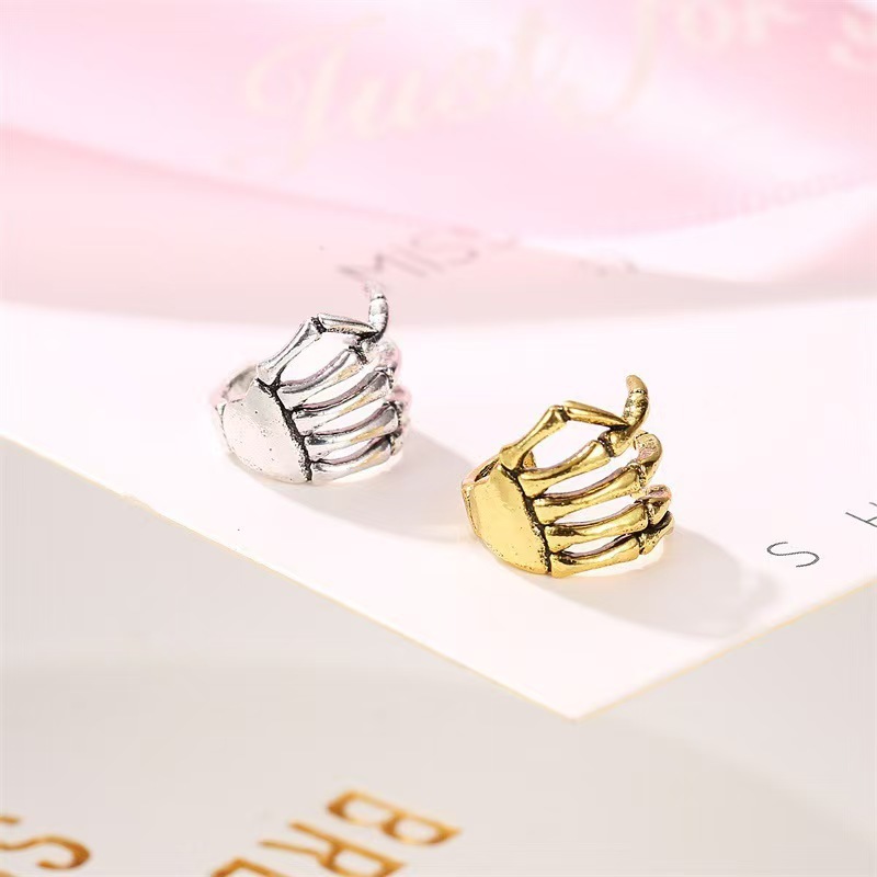 Moda europea y americana estilo punk personalidad esqueleto mano espinal hueso oreja hueso clips orejas sin agujeros de orejas joyas de orejas al por mayor