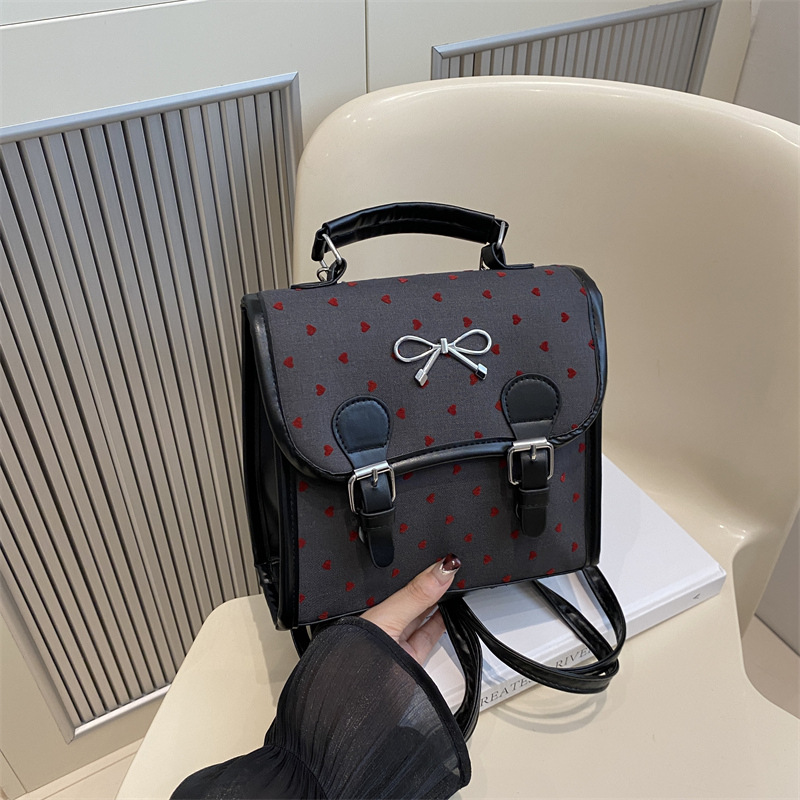 Bolsas casuales populares de este año para mujeres 2024 nueva moda vertical estilo de moda universal doble arco mochila