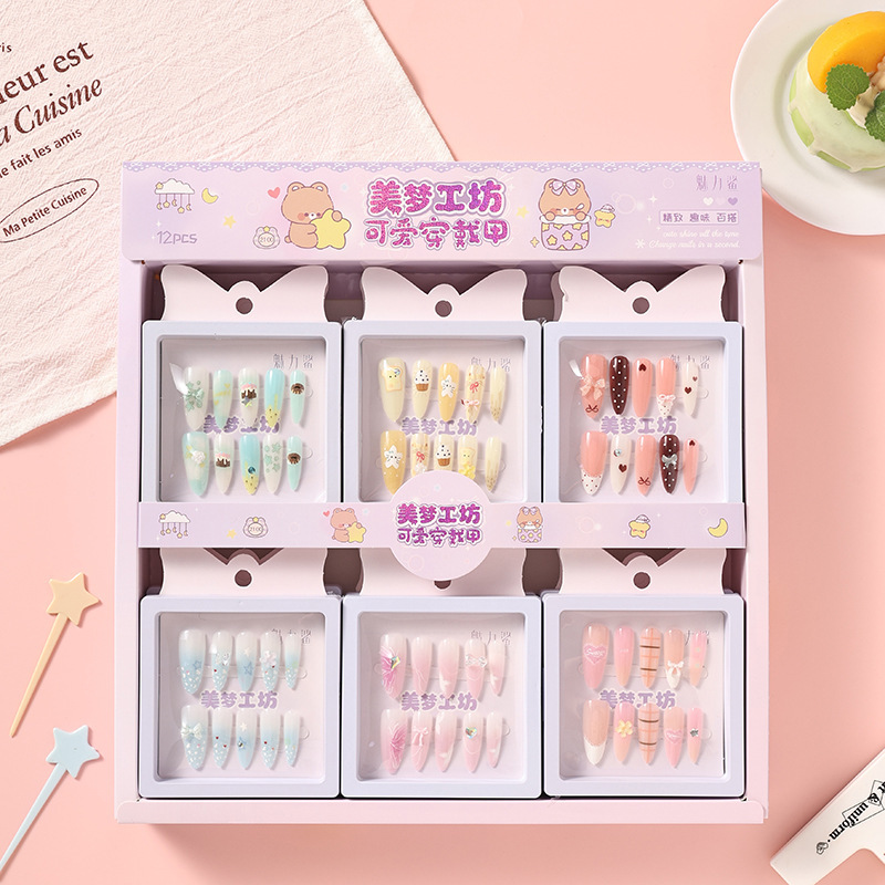 Dream Factory offers a variety of cartoon-themed, sweet-style nail art stickers in a boxed set, featuring pre-designed, detachable false nail tips Dream Factory offers a variety of cartoon-themed, sweet-style nail art stickers in a boxed set, featuring pre-designed, detachable false nail tips