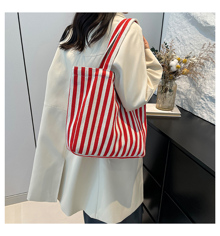 2024 Autumn/Winter new versatile and fashionable striped handbag shopping bag, two-tone large-capacity trendy single-shoulder bag undefined