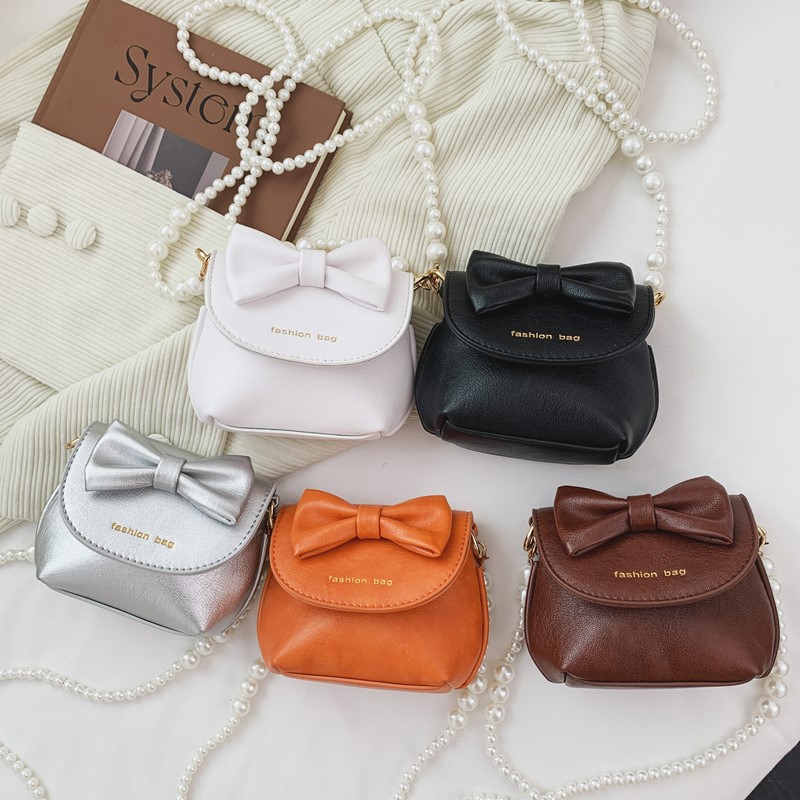 Cute mini niñas bolso de hombro dulce perla bolso de bebé coreano nuevo bolso de cambio de color sólido para niños
