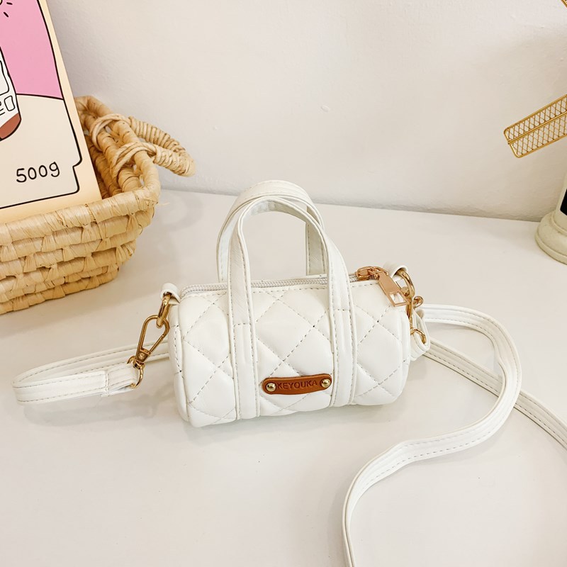 Bolsas infantiles simples de color sólido, bolsas de mini barril de moda coreana, 2025 nuevas bolsas para bebés de comercio exterior