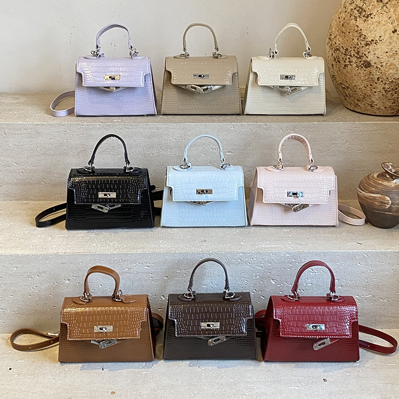Bolsos de piedra de alta calidad para mujeres 2025, nuevos bolsos de moda portátiles de invierno versátiles mochila de viaje