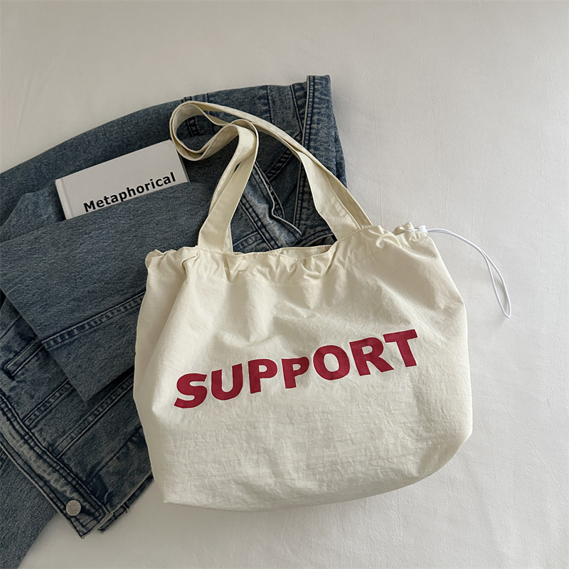 letras coreanas bolsas de lona para mujeres 2024 otoño nuevo relajado bolsas de clase de estudiantes universitarios de gran capacidad bolsas de nylon