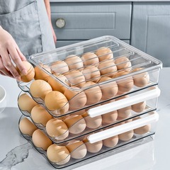 台所に卵を入れた箱に卵を入れた棚にプラスチックの卵を入れた冷蔵庫の収納ケースの多層卵収納ケース